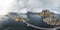 Aerial panoramic view of Reine traditional fishing village in the Lofoten archipelago in northen Norway with blue sea