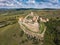 Aerial panoramic view of Rupea Fortress, Transylvania, Romania in sunny day with blue sky. Medieval fortress and saxon