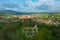 Aerial panoramic view about Schlossberg church ruins surrounded by forest.