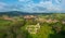 Aerial panoramic view about Schlossberg church ruins surrounded by forest.