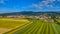 Aerial panoramic view of small town in rural Europen landscape and mountains in background, Slovenska Bistrica, Slovenia