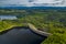 Aerial panoramic view of stone dam at reservoir near Karkonosze mountains. Dam and hydroelectric water power station