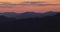 Aerial panoramic view of sunset over mountain hills