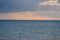 Aerial panoramic view of sunset over ocean. Nothing but sky, clouds and water. Beautiful serene