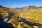 Aerial panoramic view of the Thompson river bending in its bed throughout a breathtaking mountainous landscape alongside Highway 1