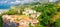 Aerial panoramic view of Tropea town with port, houses