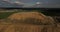 Aerial panoramic view of the urban dump. Copter flying over the big piles of garbage trash outside the city.