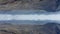 Aerial panoramic view of volcanic Icelandic landscape. Road leading through wide valley. Abstract computer effect