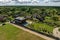 aerial panoramic view on wooden eco house or homestead in green village