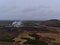 Aerial panoramic view from ÃžorbjÃ¶rn mountain with Svartsengi geothermal power plant, pipelines and small forest in Iceland.