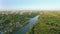 Aerial paraplane hang glider in the air above river city canyon