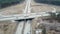 Aerial perspective of interstate commuter traffic crossing bridge on clear, early morning. Video. Aerial Footage of