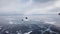 Aerial perspective view of cars driving on beautiful deep blue ice textured frozen Baikal lake surface from above