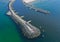 Aerial perspective view on sea breakwaters and ship port entrance