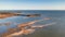 an aerial photo of a beach with lots of water in it