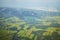 Aerial photo of beautiful landscape with meadows, forests and fields with wind turbines