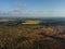 Aerial photo of bog with surrounding forests and fields.