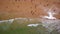 Aerial photo of the coast, the beaches of Gale in Portugal. Tourists rest in the sand and swim in the clear water.