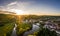 Aerial photo with drone of market KallmÃ¼nz Kallmuenz in Bavaria with river Naab and Vils and castle ruin during sunset, Germany