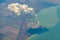 Aerial photo of Farmland. view from the plane to the ground. squares of fields under the clouds