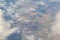 Aerial photo of Farmland. view from the plane to the ground. squares of fields under the clouds