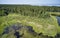 Aerial photo of forest bog in the Karakansky pine forest near the shore of the Ob reservoir