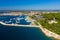 Aerial photo of hotels, beach and marina in Rovinj town