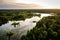 Aerial photo of the lake in the forests in sunset. Lake with small islands