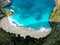 Aerial photo of Manta Bay or Kelingking Beach on Nusa Penida Island, Bali, Indonesia. Wild nature view sandy beach with rocky