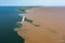 Aerial photo of the meeting of the waters of the Amazon Rivers with the TapajÃ³s River in SantarÃ©m, ParÃ¡, Brazil.