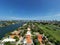 Aerial photo Miami Beach upscale homes between golf course and waterfront