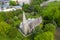 Aerial photo of an old church and church yard known as Heslington Church in the summer time in the town of York in West Yorkshire