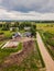 Aerial Photo of old Farmer houses with Road by its Side and Agriculture Fields Around it in Early Spring on Sunny Day