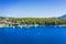 Aerial photo of sailing boats docked in blue bay of Fiskardo, Kefalonia island, Ionian, Greece