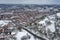 Aerial photo of a snowy day in the city of Leeds in the UK, showing rows of terrace houses with snow covered roofs in the Village