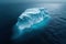 An aerial photo taken with a drone shows an iceberg drifting in the middle of the ocean