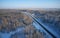 Aerial photo view of winter road in taiga on Salair Ridge in winter. Siberia, Russia