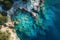 This aerial photograph captures a body of water surrounded by rocks, offering a unique perspective of the natural landscape, Bird