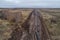 Aerial photograph of the laying pipe of large diameter in clay soil. Autumn