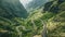 An aerial photograph showcasing the winding curves and twists of a mountain road surrounded by stunning natural scenery, A winding