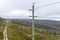 Aerial photograph of a wooden powerline pole and wires