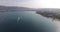 Aerial photography of the blue bay in southern Russia, the yacht enters the bay, 4K