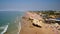 Aerial photography of the coast, the beaches of Gale in Portugal. Tourists relax under the umbrellas.