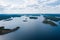 Aerial photography on Ladoga skerries. Ladoga Lake in Karelia in hot summer. Rocky wild islands in the middle of the