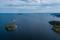 Aerial photography on Ladoga skerries. Ladoga Lake in Karelia in hot summer. Rocky wild islands in the middle of the