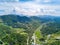 Aerial photography of magnificent scenery of blue sky and green mountains at Kunlun Pass in Nanning, Guangxi, China