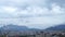 Aerial photography of panorama of Henan City in China, rooftop buildings across the skyline to vast mountain range in the distance