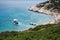 Aerial photography shot of a boat approaching the small beach in Amorgos, Greece