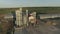 Aerial photography unloading grain from trucks at the grain warehouse in September in the evening