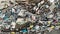 Aerial photography waterfront heap pile of garbage. Above top view plastic bottles rubbish pollution marine debris on lakeshore.